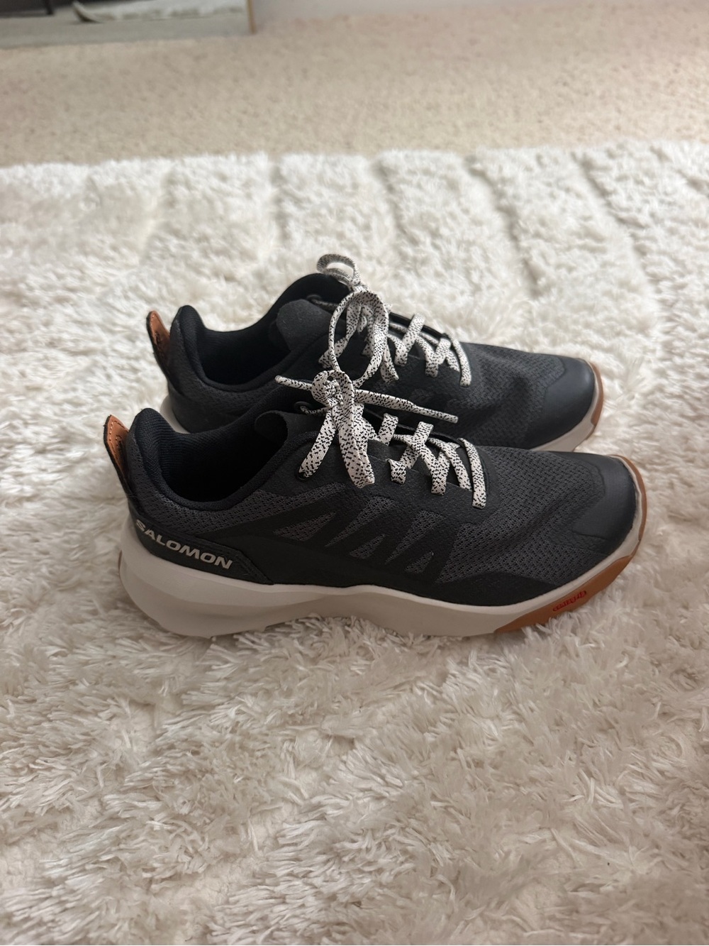 Salomon Black Sneakers with White Laces and Brown Accents